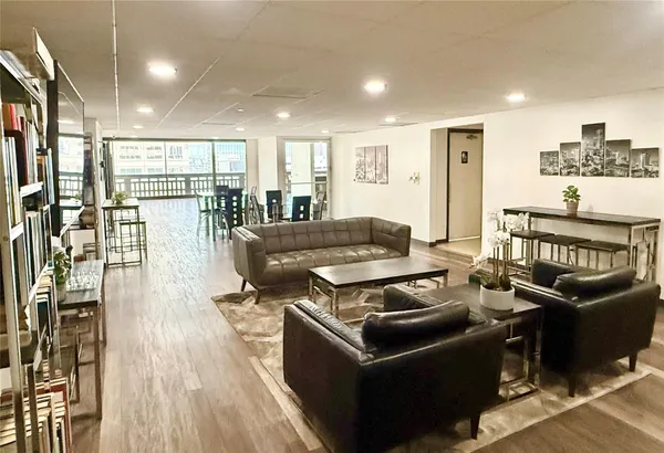 a living room with furniture and a table