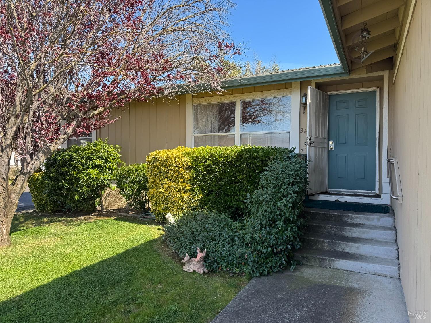 2555 Flosden Road, Unit 34 American Canyon, CA 94503 - Photo 1 of 1 a front view of a house with garden