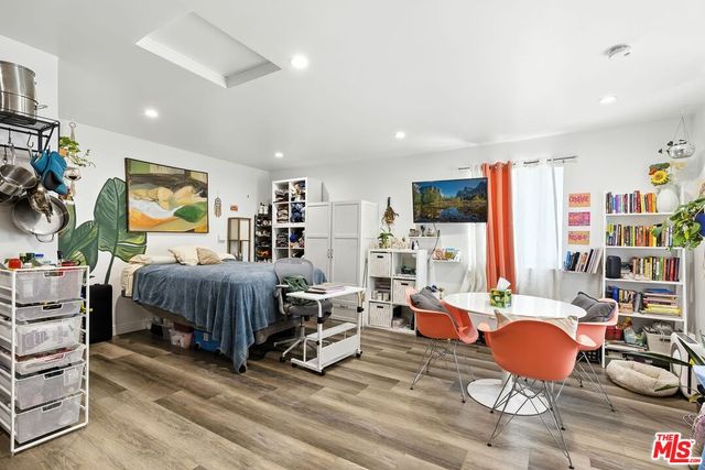 a living room with furniture and kitchen view