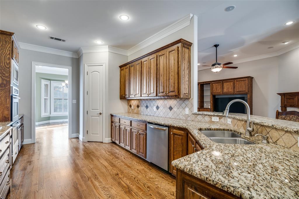 711 Ridgeview Drive Rockwall, TX 75087 - Photo 14 of 39 a kitchen with stainless steel appliances granite countertop a sink stove and refrigerator