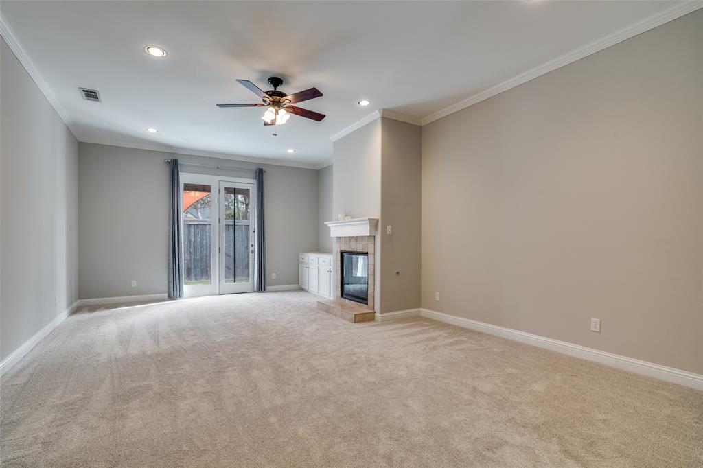711 Ridgeview Drive Rockwall, TX 75087 - Photo 17 of 39 a view of an empty room with a ceiling fan and window