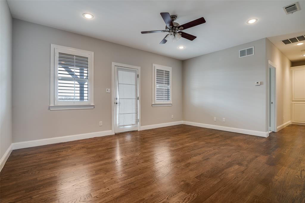 711 Ridgeview Drive Rockwall, TX 75087 - Photo 25 of 39 a view of an empty room with a window and wooden floor