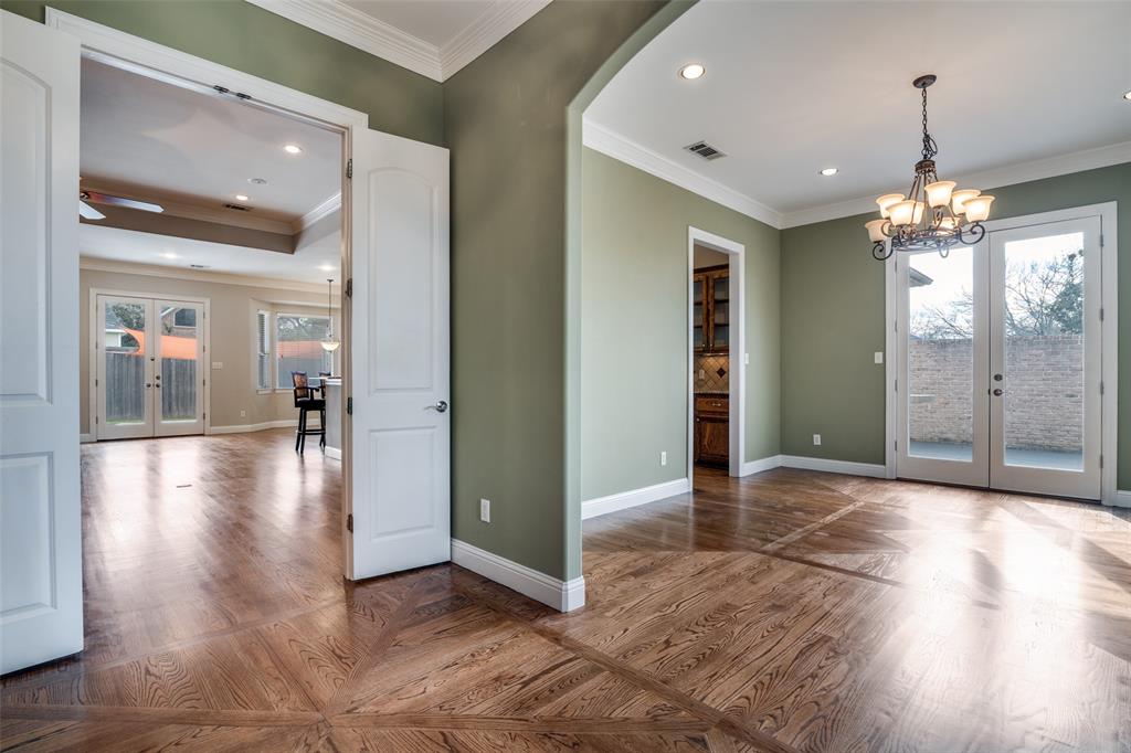711 Ridgeview Drive Rockwall, TX 75087 - Photo 7 of 39 a view of a hallway with wooden floor chandelier and livingroom view