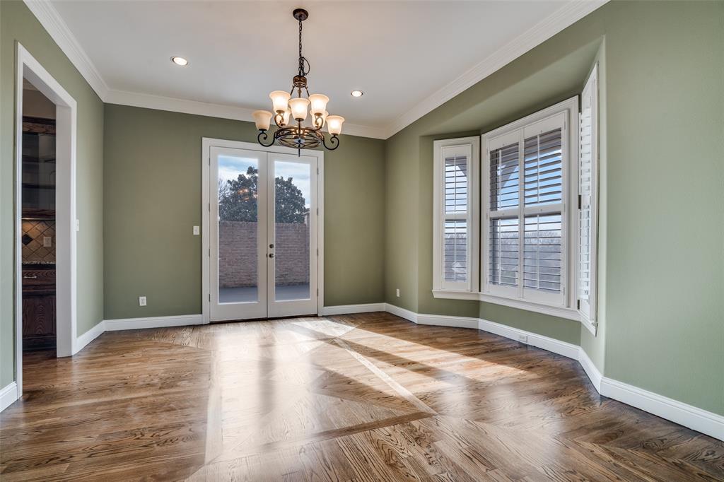 711 Ridgeview Drive Rockwall, TX 75087 - Photo 8 of 39 a view of a livingroom with a chandelier wooden floor and windows