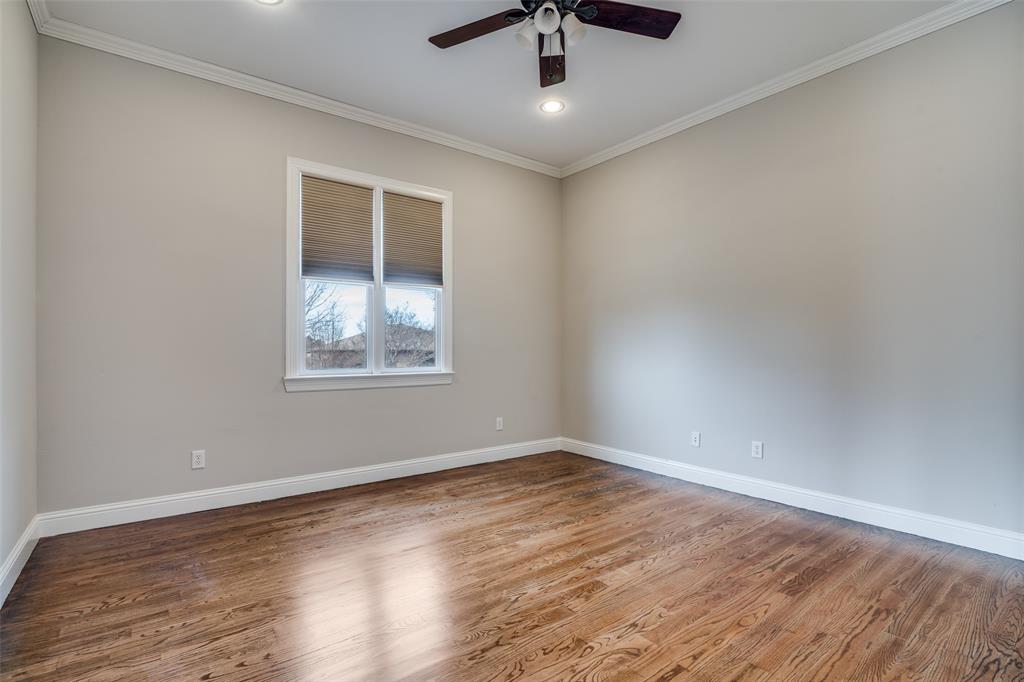 711 Ridgeview Drive Rockwall, TX 75087 - Photo 9 of 39 a view of an empty room with wooden floor and a window
