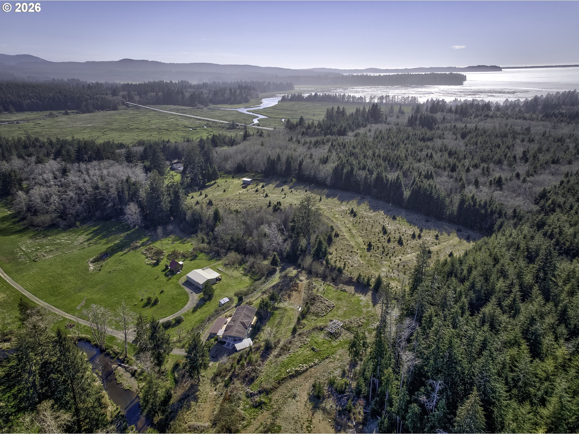 47 North Nemah Road East South Bend, WA 98586 - Photo 30 of 33 a view of a lush green hillside and a houses