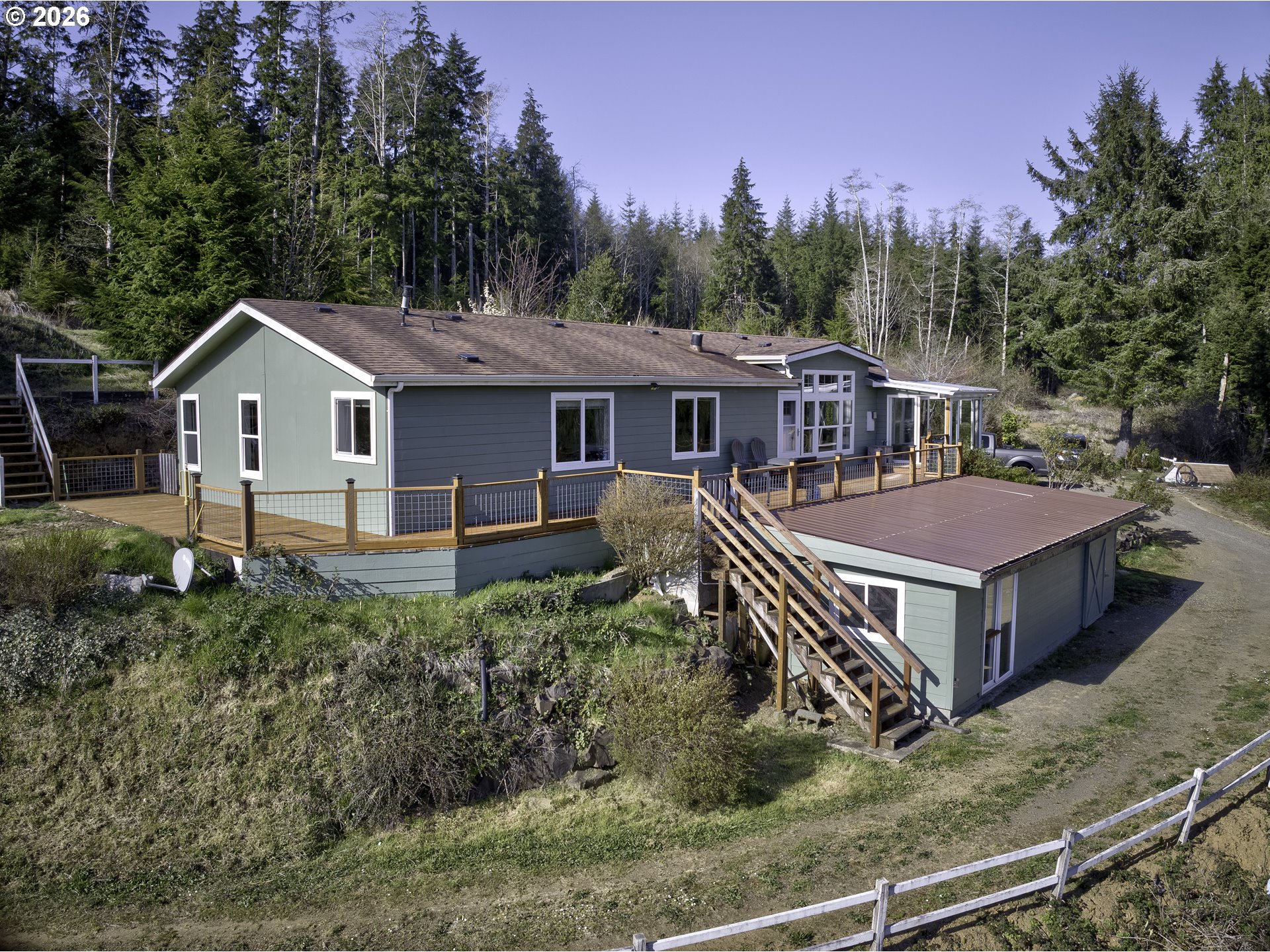 47 North Nemah Road East South Bend, WA 98586 - Photo 32 of 33 a front view of a house with a yard and balcony