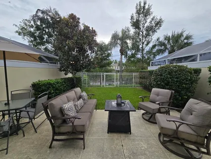 a view of yard with seating area and green space