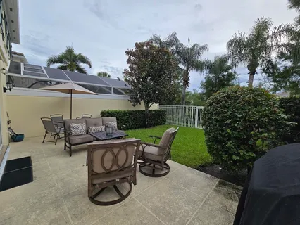 a view of a chairs and table in the patio
