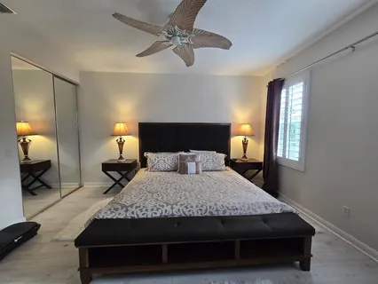 a bedroom with a bed and window