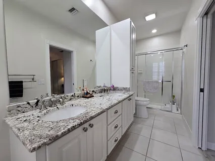 a white bath tub sitting in a bathroom next to a window