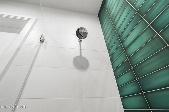 a bathroom with a sink double vanity and a mirror