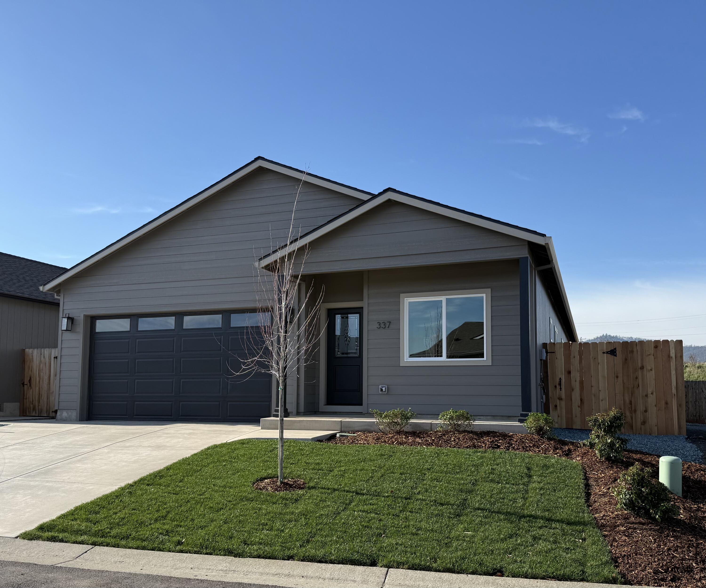 337 Quail Circle Talent, OR 97540 - Photo 2 of 25 a front view of a house with a yard