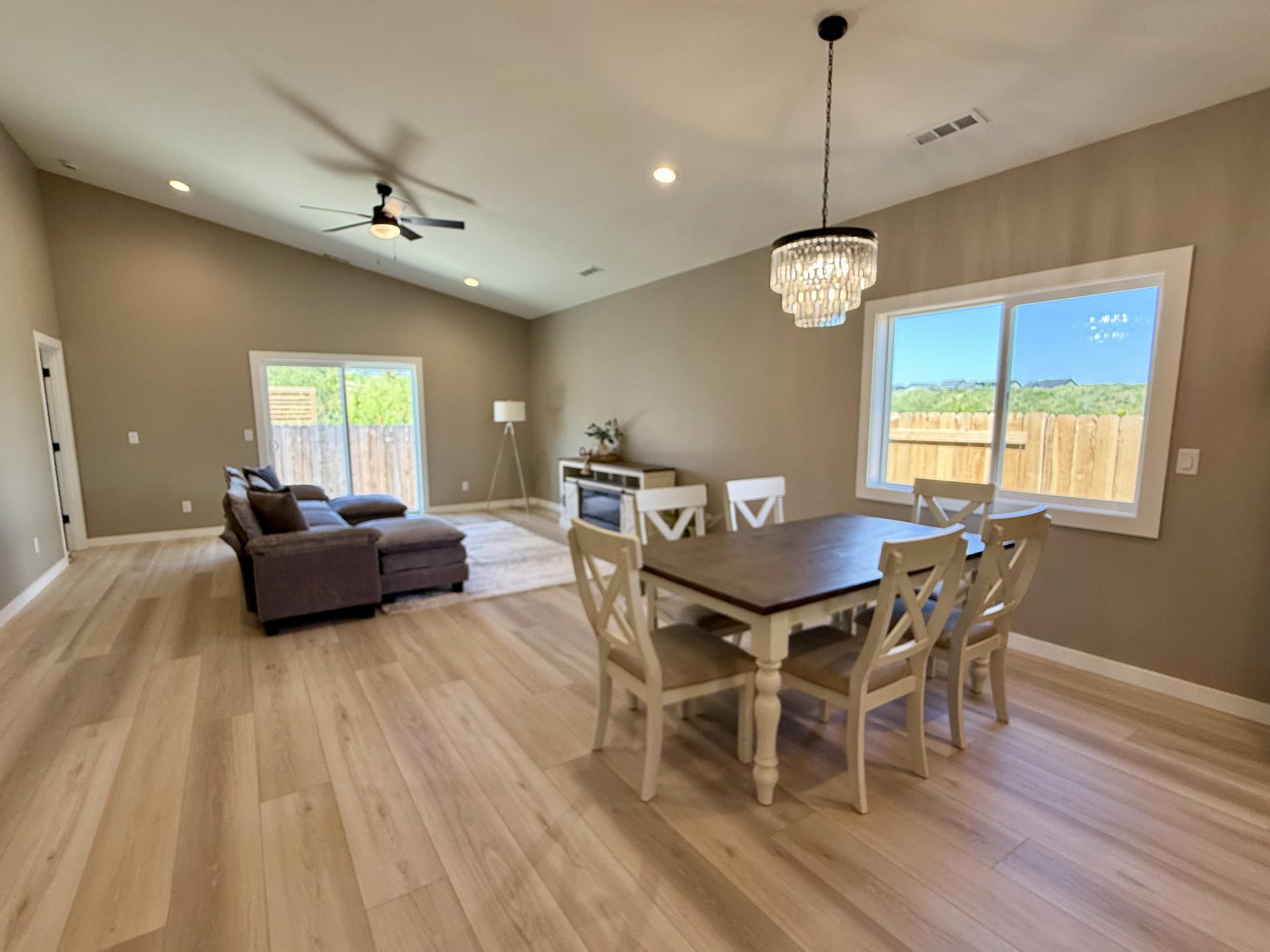 337 Quail Circle Talent, OR 97540 - Photo 8 of 25 a view of a dining room with furniture window and wooden floor