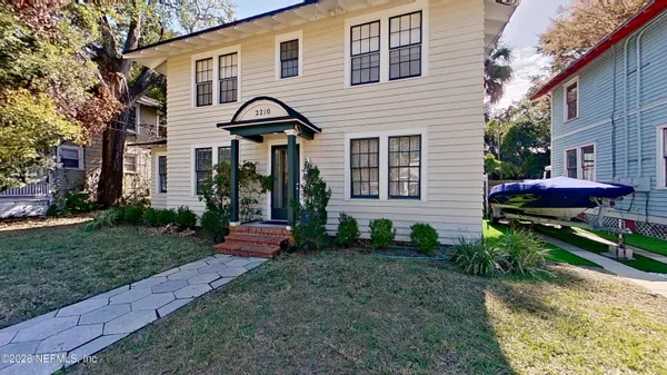 a front view of a house with garden