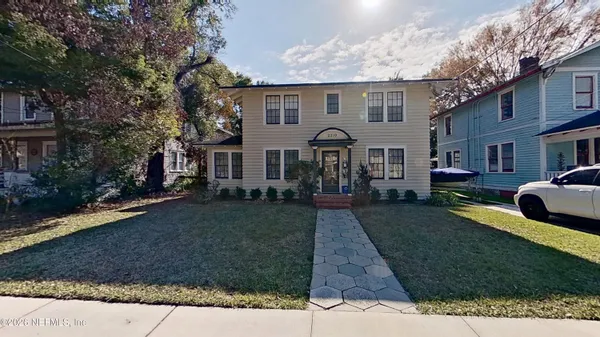 a front view of a house with garden