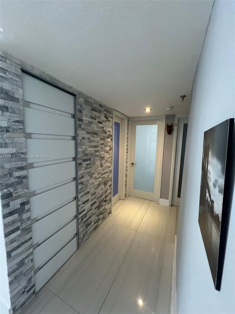 17878 North Bay Road, Unit 507 Sunny Isles Beach, FL 33160 - Photo 17 of 47 a view of entryway with wooden floor