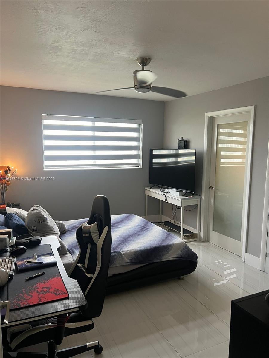 17878 North Bay Road, Unit 507 Sunny Isles Beach, FL 33160 - Photo 32 of 47 a bedroom with furniture and a window