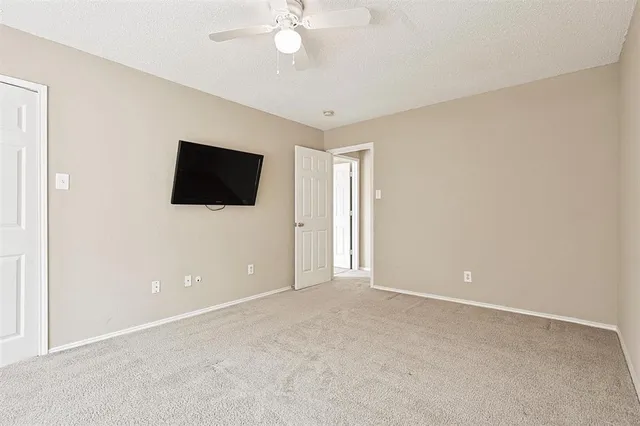 a view of an empty room with a flat screen tv