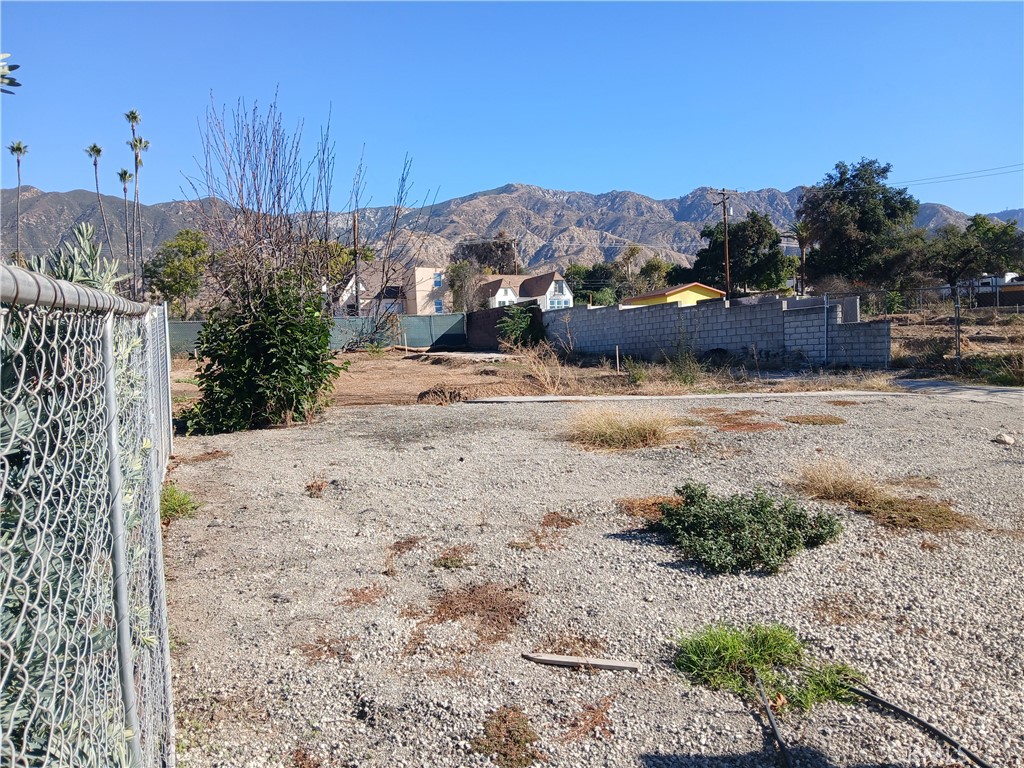 321 West Terrace Street Altadena, CA 91001 - Photo 8 of 11 a view of a dry yard with mountains in the background