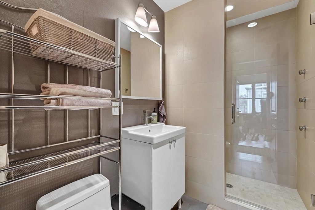 45 Vinton Street, Unit 4 Boston, MA 02127 - Photo 11 of 28 a bathroom with a sink toilet and shower