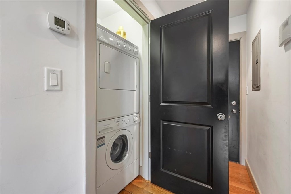 45 Vinton Street, Unit 4 Boston, MA 02127 - Photo 13 of 28 a view of a hallway with washer and dryer