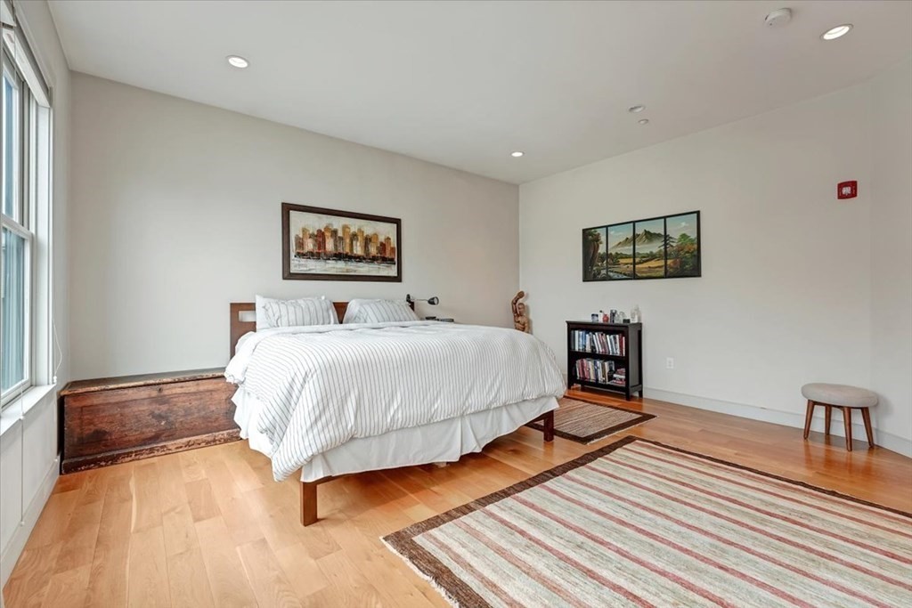 45 Vinton Street, Unit 4 Boston, MA 02127 - Photo 15 of 28 a bed room with a bed and a chair