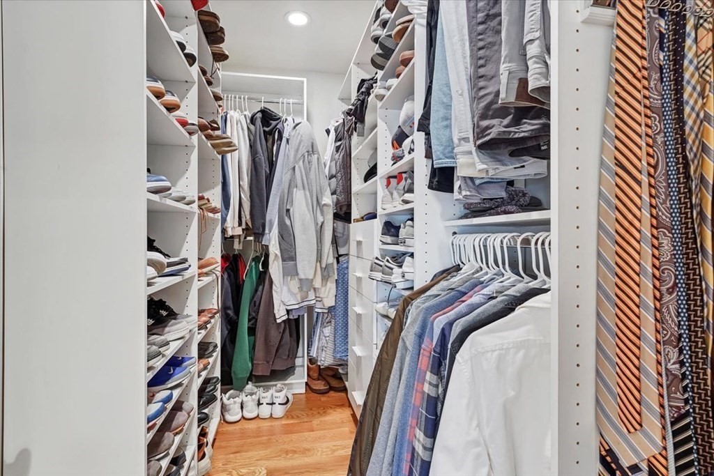 45 Vinton Street, Unit 4 Boston, MA 02127 - Photo 17 of 28 a view of walk in closet with clothes and shoes