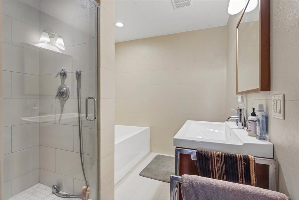 45 Vinton Street, Unit 4 Boston, MA 02127 - Photo 18 of 28 a bathroom with a sink and a mirror