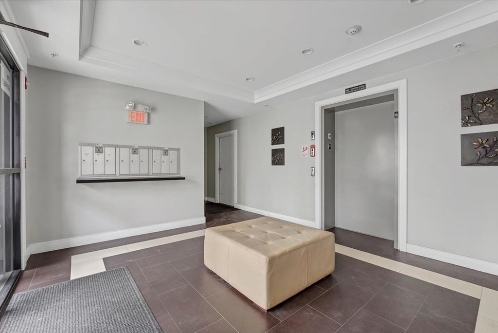 45 Vinton Street, Unit 4 Boston, MA 02127 - Photo 21 of 28 a living room with furniture and wall painting