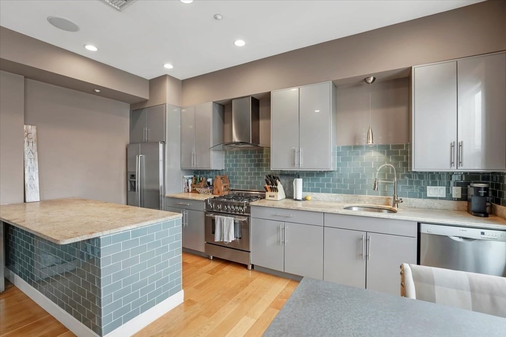 45 Vinton Street, Unit 4 Boston, MA 02127 - Photo 6 of 28 a kitchen with a sink stove and refrigerator