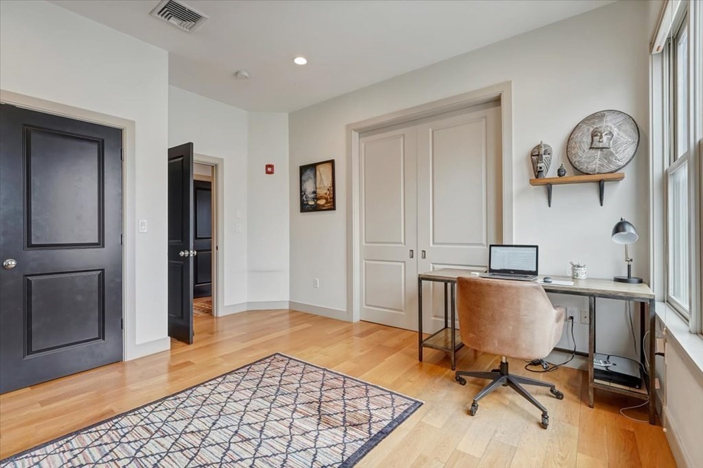 45 Vinton Street, Unit 4 Boston, MA 02127 - Photo 10 of 28 a view of a workspace with furniture and a window