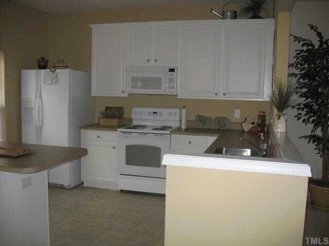 8213 Clasara Circle Raleigh, NC 27613 - Photo 3 of 9 a utility room with dryer and washer