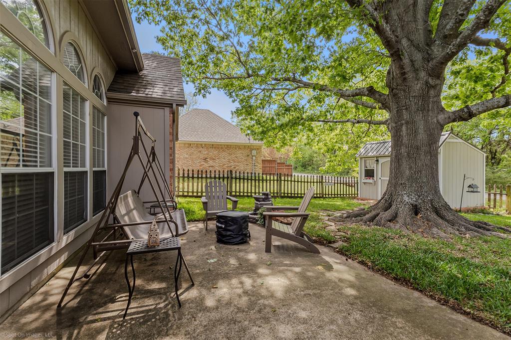 1790 Wind Hill Road Rockwall, TX 75087 - Photo 26 of 29 a view of a bench in a backyard