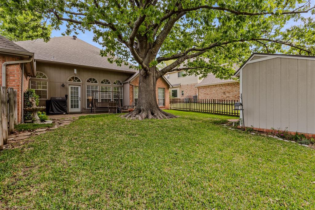 1790 Wind Hill Road Rockwall, TX 75087 - Photo 27 of 29 a view of a house with a yard