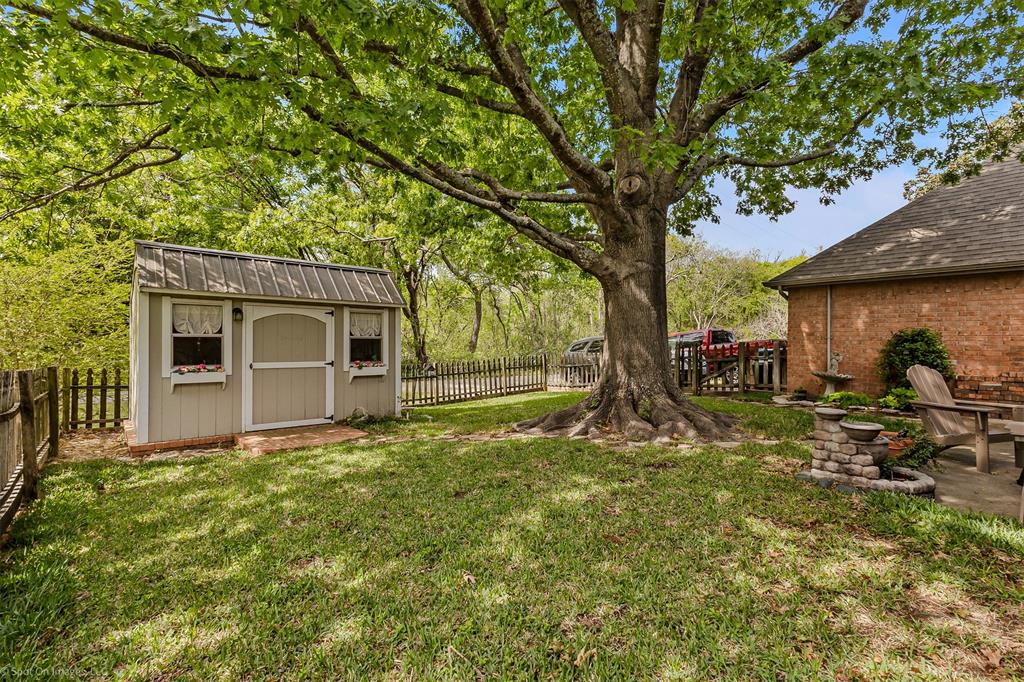 1790 Wind Hill Road Rockwall, TX 75087 - Photo 28 of 29 a front view of a house with garden