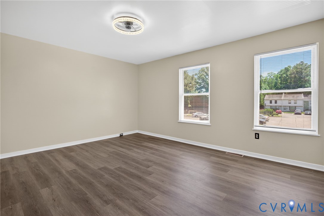 10050 Purcell Road Richmond, VA 23228 - Photo 15 of 26 a view of an empty room with wooden floor and a window