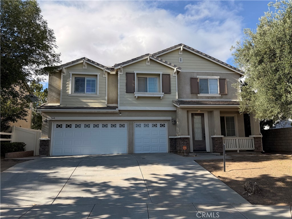 562 Quigley Lane Perris, CA 92570 - Photo 1 of 29 a front view of a house with a yard