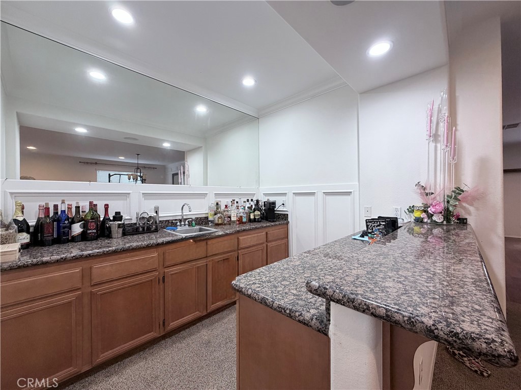 562 Quigley Lane Perris, CA 92570 - Photo 4 of 29 a kitchen with sink and stove