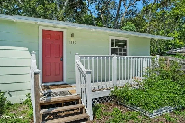 a view of a wooden door with a bench