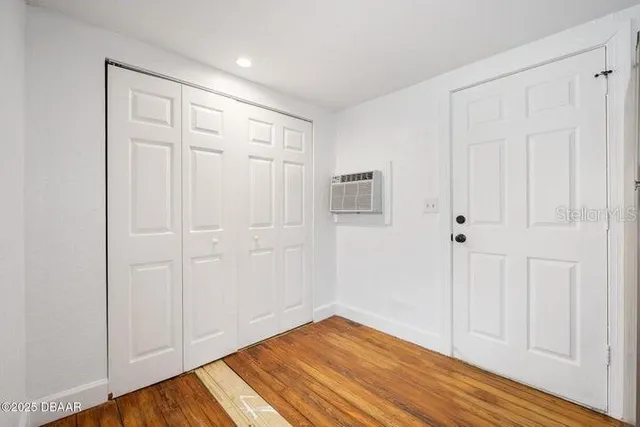 a view of a livingroom with wooden floor