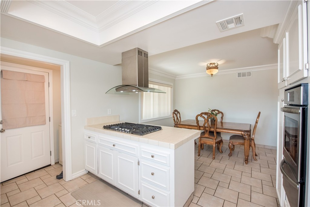 4459 Pine Street Pico Rivera, CA 90660 - Photo 13 of 38 a kitchen with a stove and a refrigerator