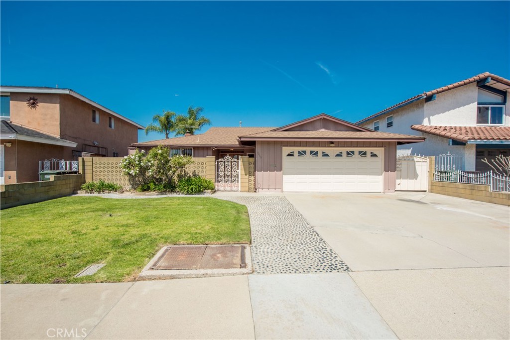 4459 Pine Street Pico Rivera, CA 90660 - Photo 2 of 38 a front view of a house with a garden