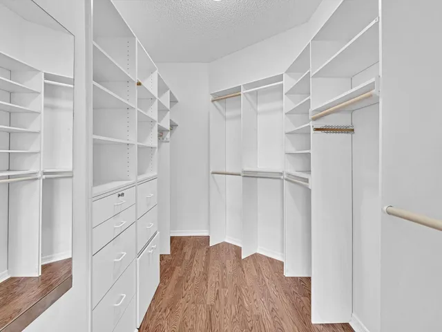 an empty room with wooden floor