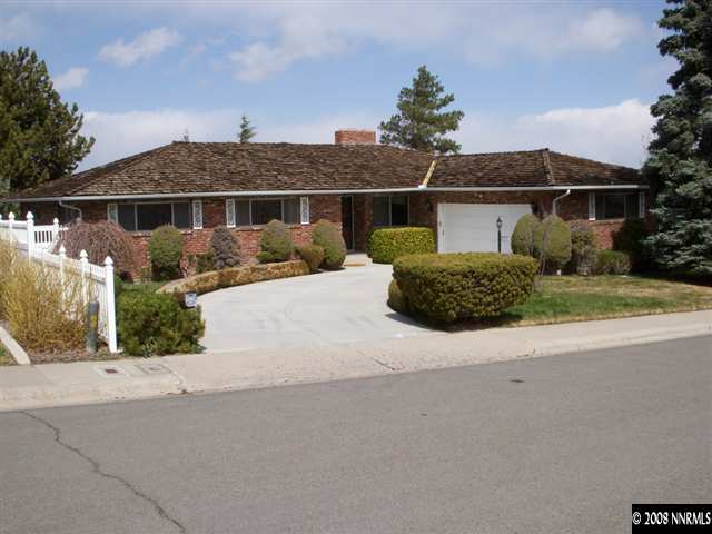 3095 Heatheridge Lane Reno, NV 89509 - Photo 1 of 6 front view of a house with a yard