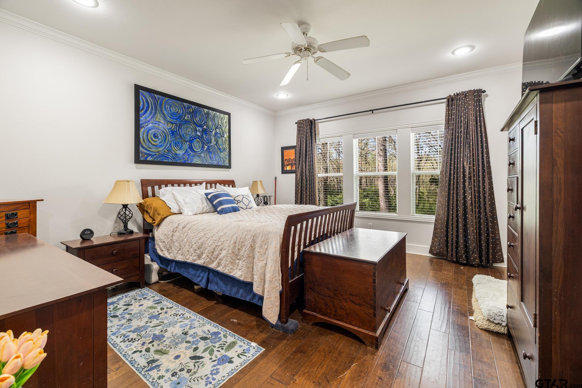 9453 Cherokee Trail Tyler, TX 75703 - Photo 17 of 40 a bedroom with a large bed and a couch