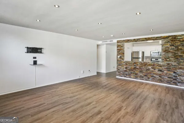 a view of a livingroom with wooden floor