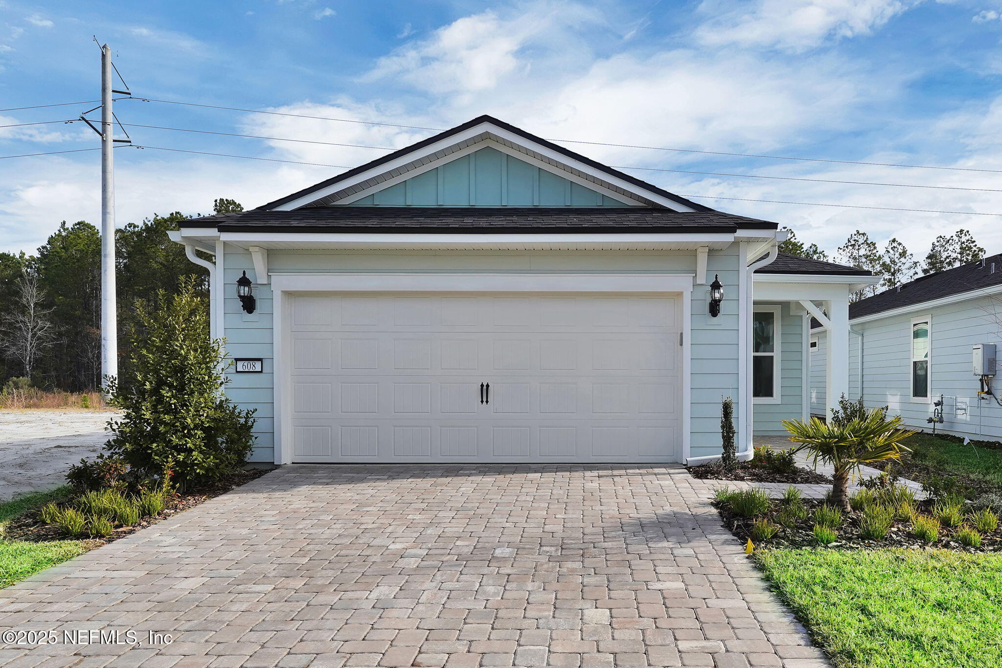 608 Ecliptic Loop Yulee, FL 32097 - Photo 1 of 49 a front view of a house with a yard