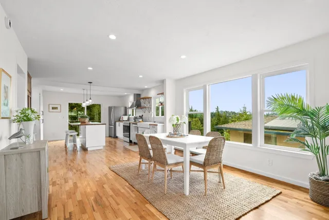 a view of a dining room with furniture window and outside view