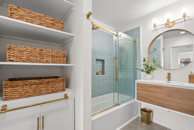 a bedroom with a large bed and a wooden floor